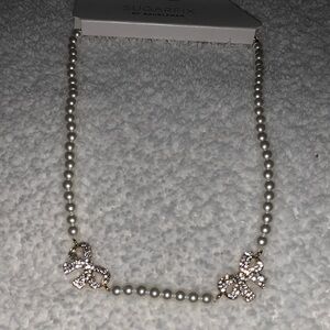 Gold and White Pearl Necklace With Gold Bows encrusted with stones